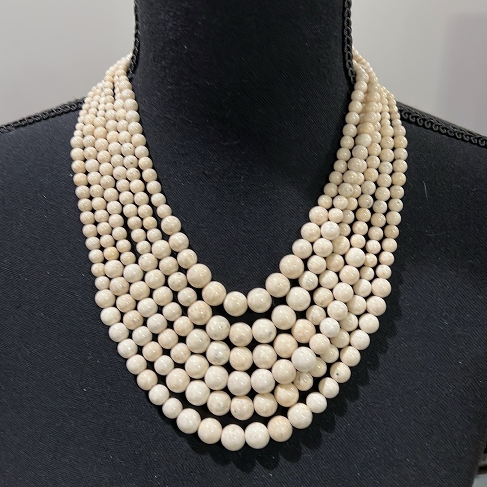 Gorgeous multi strand ivory marble necklace.